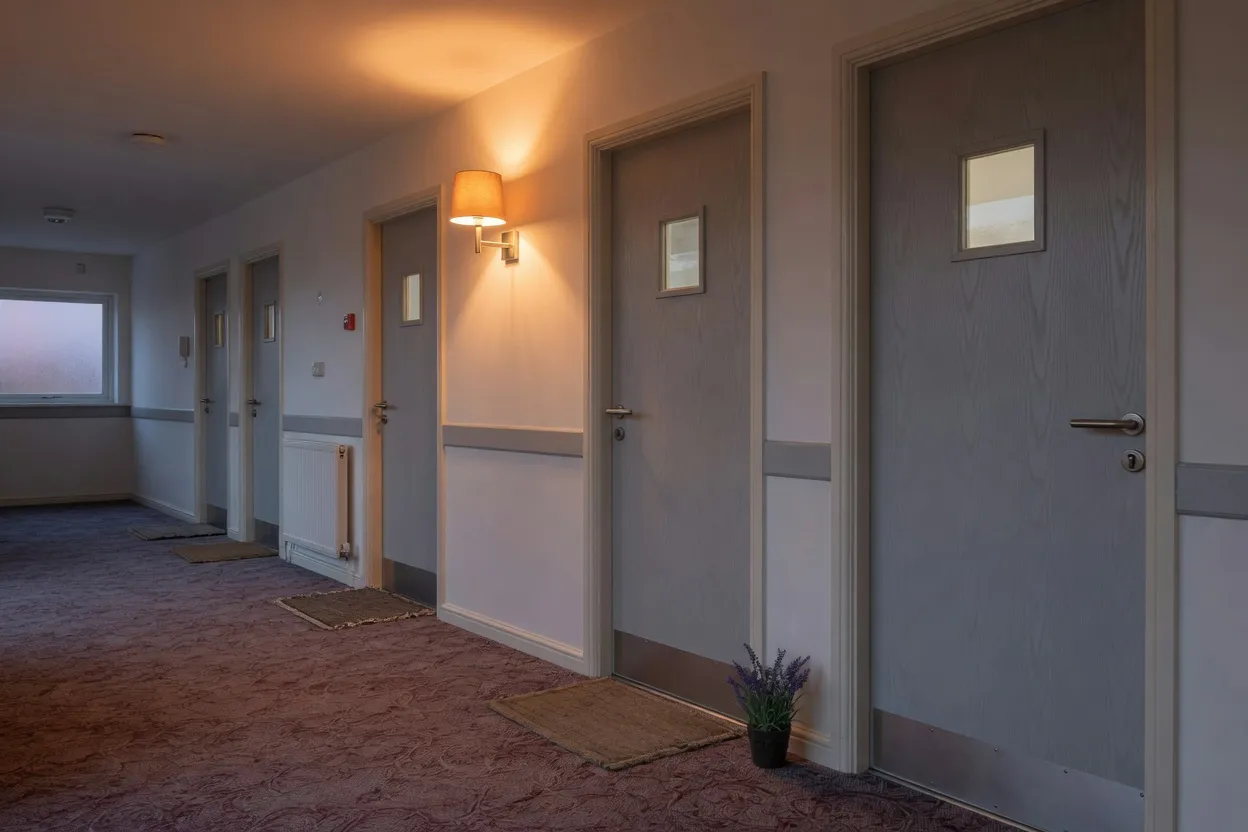 Communal corridor at a sheltered housing scheme in warm evening light