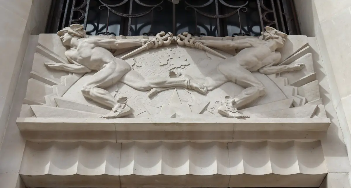 Alfred Oakley's carved stone relief of two figures above the Peterborough Court doorway